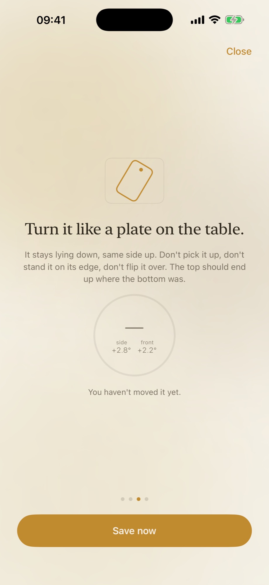 A step of the calibration wizard. The heading reads “Turn it like a plate on the table”, with instructions not to pick the phone up or stand it on its edge, a small dial showing side plus 2.8 degrees and front plus 2.2 degrees, and a Save now button at the bottom.